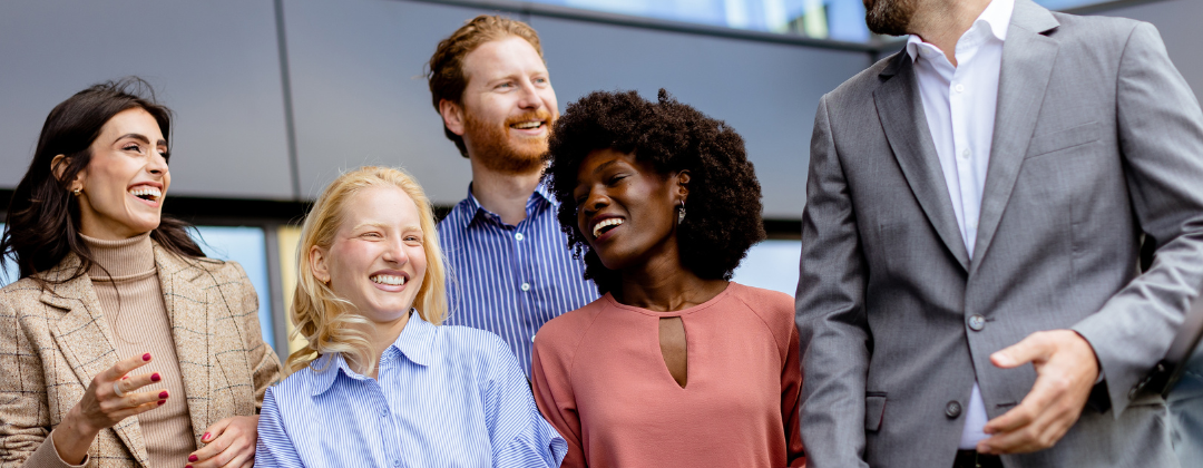 A group of happy employees content with their companies effort to t=build employee benefits strategies