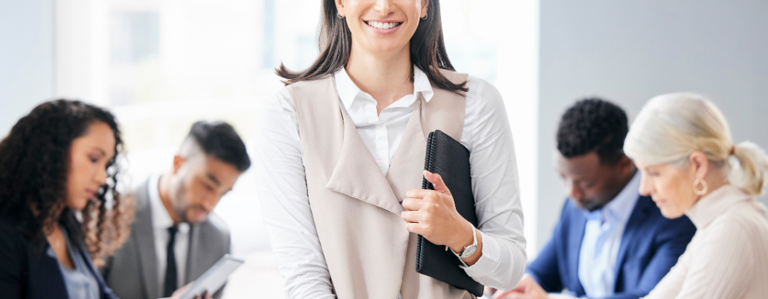 A manager at a company meeting with her team in order to keep retaining the top talent