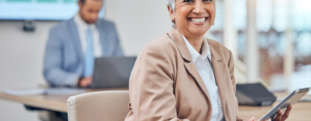 An employee happy with her company's career progression plan for employees